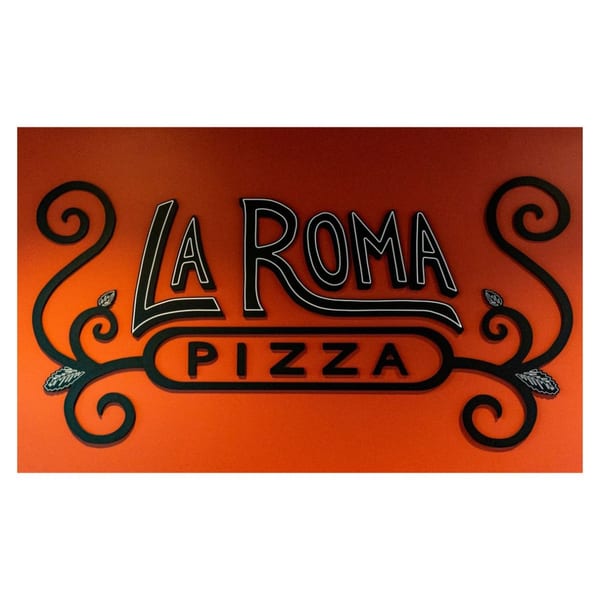 La Roma Pizza sign with black and white outlined letters on an orange background, adorned with decorative swirls.